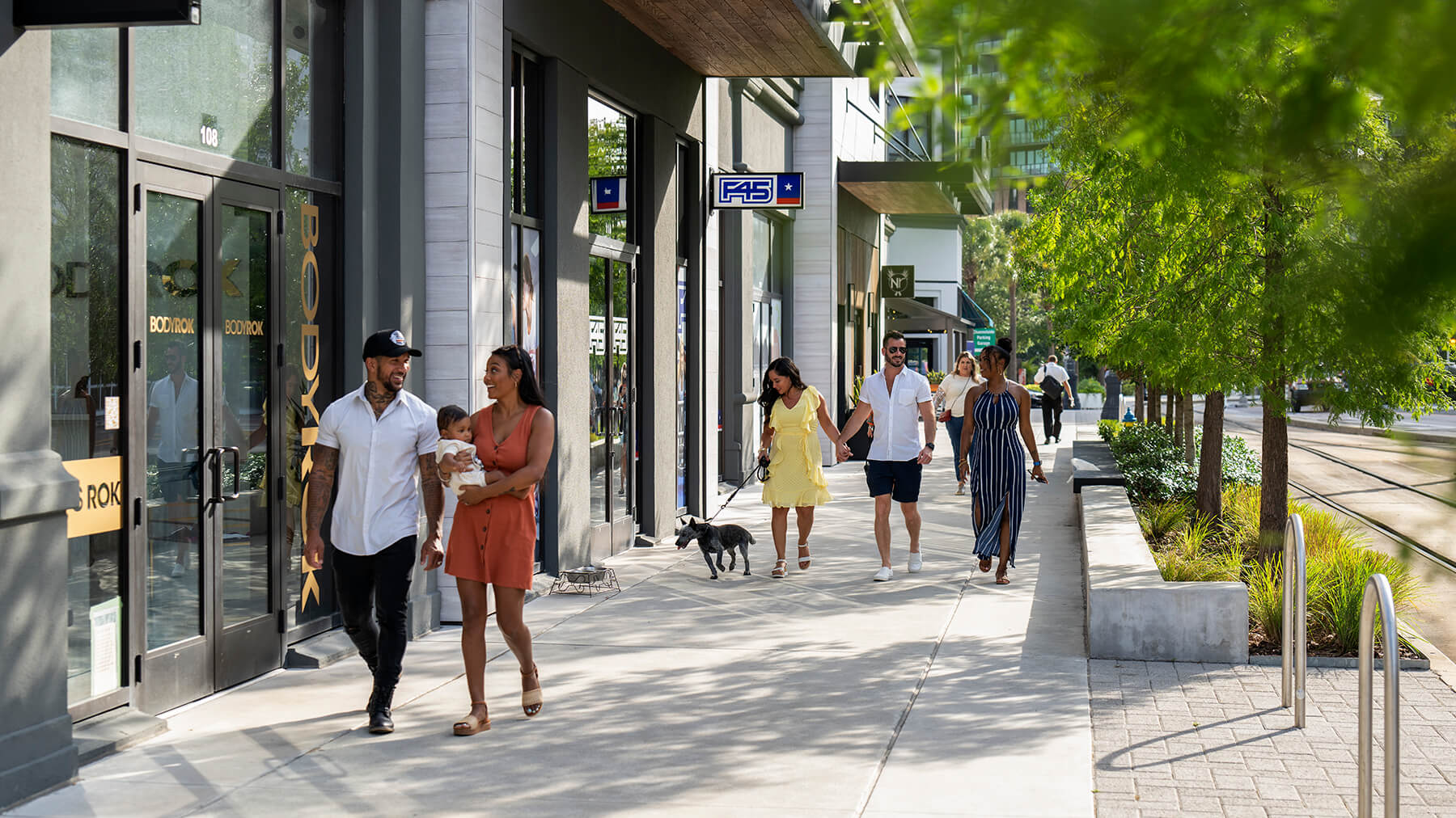 Pedestrians walk down channelside drive in the Water Street Tampa neighborhood